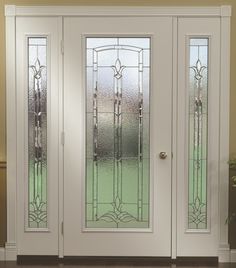 a white double door with stained glass panels