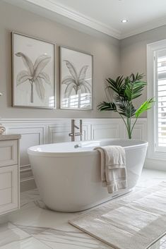 a large white bath tub sitting next to a window