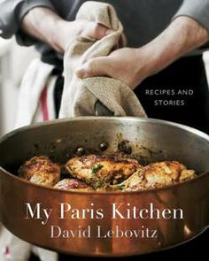 the cover of my paris kitchen by david lebovitz, with a person holding a pan full of food