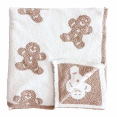 two towels with teddy bears on them, one is brown and the other is white