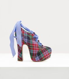 First shown in our Spring-Summer 1993 'Anglomania' collection in Paris, the Elevated Ghille platforms feature elements reminiscent of ghillie brogues, traditional Scottish shoes worn with Highland dress, but exaggerated and elevated to create a bold statement. This season, the piece is offered in the 'Circus Tartan' motif, complete with ribbon laces. Ghillie Shoes, Ghillie Brogues, Tartan Design, Ballerina Shoes, Naomi Campbell, Footwear Design Women, Runway Show, Dream Shoes, Capsule Collection