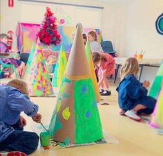 the instagram page shows children playing with paper cones and other crafting materials in an art class