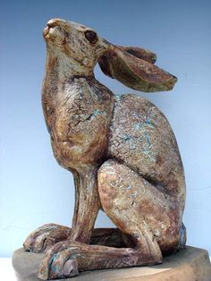 a statue of a rabbit sitting on its hind legs