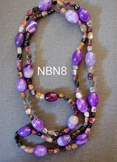 Pretty in purple, this 40" long necklace features 3/4" banded purple agate ovals stationed among smaller, polished, multicolor agate beads. This never worn piece may be worn long or doubled over, and comes to you in a small jewel box. Purple Board, Pretty In Purple, Purple Bead Necklace, Purple Agate, Jewel Box, Agate Necklace, Agate Beads, Windsor, Long Necklace