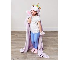 Little ones will love snuggling up with this unicorn-themed hooded throw blanket. Soft royal plush fabric is sure to keep them warm and cozy. Featuring a magical, mystical design complete with embellishments and pockets for "hooves;" this throw is a cute way to cuddle up in softness when lounging around or on the go. Ways To Cuddle, Mystical Design, Big Lots Store, Purple Unicorn, Blanket Soft, Plush Fabric, Warm And Cozy, The Go, Throw Blanket