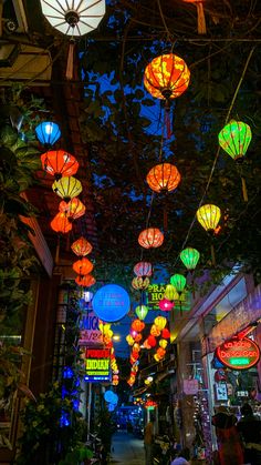 many colorful lights are hanging from the ceiling