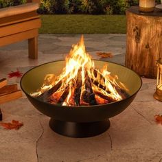 a fire pit sitting on top of a stone patio