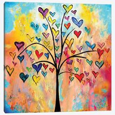 a tree with hearts painted on it is shown in multicolors and has many colors