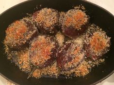 some food is being cooked in a pan on the stove top and ready to be eaten