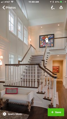 the stairs in this house are white and brown with wood trimmings on them