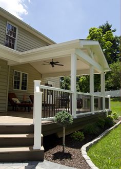 a house with a covered porch and stairs