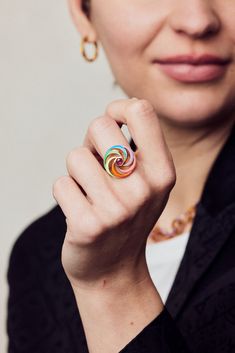 Catherine Spinning Ring with ruby hexagon centre and multi-coloured enamel in gold vermeil. This enamel ring makes the ultimate luxury fidget spinner, as it spins beautifully on a ball-bearing mechanism. The outside of the band of this spinning ring has a diamond blast matt finish to it, which gives a lovely texture. The inside and reverse of the disk is in a high-polish finish. Ring With Ruby, Spinning Ring, Spinning Rings, Jewellery Brand, Demi Fine Jewelry, Enamel Ring, Spinner Rings, Fidget Spinner, Ball Bearing