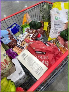 a shopping cart filled with groceries and food