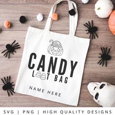 a white bag with the words candy lat bag on it next to halloween decorations