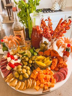 a platter filled with different types of food and condiments on a table