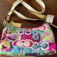 A Brand New 10x7 Coach Purse Retro Crossbody Bag With Gold-tone Hardware, Designer Multicolor Bag With Adjustable Strap, Designer Multicolor Shoulder Bag With Adjustable Strap, Designer Multicolor Bags With Adjustable Strap, Multicolor Retro Coach Bag, Designer Multicolor Crossbody Satchel, Elegant Multicolor Coach Bag, Coach Multicolor Shoulder Bag With Detachable Handle, Multicolor Coach Shoulder Bag For Everyday Use