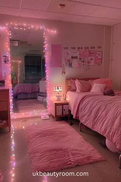 a bedroom with pink lights on the walls and carpeted flooring in front of a mirror