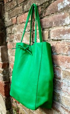 Large tote leather bag in GREEN. Leather shopper in Green closed with 2 leather straps at the top. Large enough for laptops, tablets, books etc. Natural GENUINE leather. The inside of the bag is not lined (although properly finished!). We added a small leather pouch on the inner part of the bag Excellent quality, soft but strong genuine leather. Width upper part: 41cm - 16 inch Height: 38 cm - 15 inch This listing is for the bag in GREEN ( first 4 pics). Also avalable in taupe, beige, black, bro Green Hobo Bag With Adjustable Strap For On-the-go, Modern Green Bucket Bag With Leather Handles, Green Rectangular Leather Bag, Green Bucket Satchel, Square Green Bucket Bag, Green Hobo Bag With Adjustable Strap And Double Handle, Green Satchel With Leather Handles For On-the-go, Green Bags For Everyday Use, Green Square Leather Bucket Bag