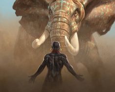 an elephant standing next to a man in the desert