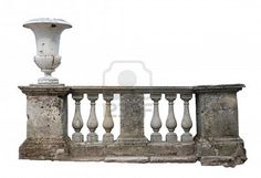 an old stone balcony railing with a white lamp on the top, and another one in the background