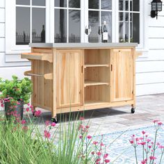 This outdoor kitchen island adds handy surface space and plenty of storage to your patio or deck. It features a thick stainless steel countertop that's great for slicing and dicing, placing down trays, or setting out some cold beverages on a hot day. The frame is crafted from solid fir wood with a distressed, natural finish for plenty of farmhouse charm, and it rests on casters for fuss-free mobility. Two cabinets with shiplap paneling and three open shelves provide room for everything from bott Outdoor Kitchen Cart, Patio Bars, Shiplap Paneling, Outdoor Patio Bar Sets, Outdoor Patio Bar, Outdoor Kitchen Island, Stainless Steel Countertops, Patio Bar Set, Fir Wood