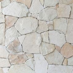 a stone wall made up of small rocks