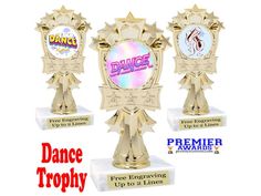 three trophies with the words dance trophy written on one side and an award in the other