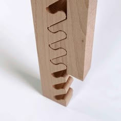 a wooden object with the word susu written on it's side and an upside down section