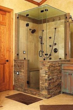 a bathroom with a stone shower and sink