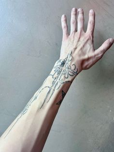 a person's arm with a tattoo on it and an arrow in the middle