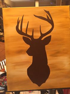 a painting of a deer's head with antlers on it