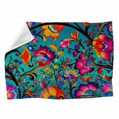 a blue blanket with colorful flowers on it