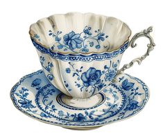 a blue and white tea cup with saucer, spoon and plate on a white background