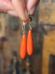 An outstanding pair of Victorian coral torpedo drops with sumptuous button tops. I have handled many pairs of Victorian coral earrings, but none with the sharp, excellent simplicity of this pair. If you've enjoyed a look at our Georgian Chalcedony torpedo earrings, what is so lovely about these Coral drops is that they detail the progression of the classic 19th century torpedo shape; whereas the chalcedony pair from the 1820's shows a dormeuse top, and conical fitted hold for the drops to attach Luxury Coral Gemstone Jewelry, Coral Drop Earrings, Coral Earrings, Coral Jewelry, Antique Jewellery, Fine Jewellery Earrings, Earring Gifts, Coral, Vintage Jewelry