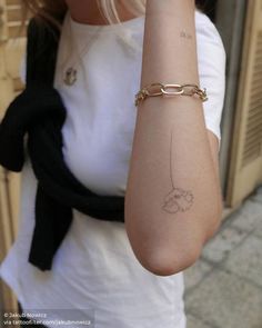 a woman with a tattoo on her arm