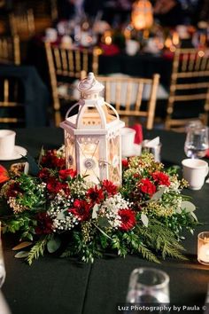 a table with candles and flowers on it