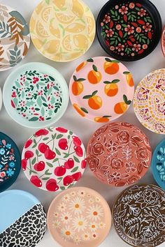 many different colored plates with designs on them