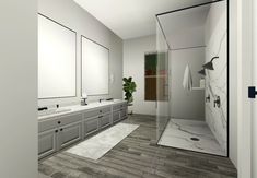 a bathroom with two sinks, mirrors and a walk - in shower next to each other