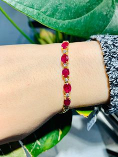 Stunning Vintage 14K Yellow Gold Diamond Ruby Bracelet: Stunning Genuine Diamonds and Natural Ruby 5 stone oval shape 6x4 mm Ruby(s): 4.40CT Diamond(s): 0.16CT Color: G Clarity: SI2 Total Bracelet Weight: 8.7GR Bracelet Length: 7in Bracelet Width: 5 mm 14K Yellow Gold For more information regarding this item feel free to reach me so I can accommodate your needs. Thank you Oval Gemstone Tennis Bracelet In Fine Jewelry Style, Oval Ruby Gemstone Tennis Bracelet, Oval Yellow Gold Bracelet With Prong Setting, Gold Oval Ruby Bracelets, Oval Ruby Bracelet In Gold, Oval Ruby Tennis Bracelet For Formal Occasions, Oval Gold Ruby Bracelets, Formal Ruby Oval Tennis Bracelet, Oval Gemstone Tennis Bracelet For Anniversary