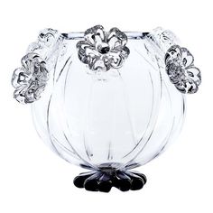 a clear glass vase with an intricate design on the top and bottom, sitting in front of a white background