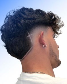 Curly Mohawk Fade with Shaved Lines Fade Haircut Line Design, Burst Fade With Cross Design, Mens Burst Fade Haircut Short, Hair Lining For Men, Fade Lines Haircut, Burst Fade Mohawk With Design, Line In Haircut Men, Hair Line Designs For Men