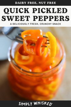 a glass jar filled with pickled sweet peppers