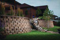 a large brick wall in front of a house