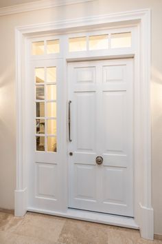 a white door with two sidelights in a room