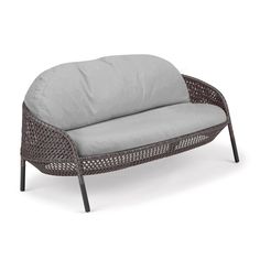 an outdoor lounge chair with a cushion on the back and seat cushions in grey color