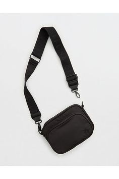 THE LOOK: Smooth, durable nylon./THE FEEL: Two compartments with zipper closure./THE MOVES: Your everyday, on-the-go routine./Accessibility deets: comfortable, adjustable strap designed with you in mind! Thick Strap Crossbody Bag, Everyday Purse Casual, Everyday Purse, Offline By Aerie, Black Crossbody Bag, Crossbody Bags For Travel, Black Crossbody Purse, Festival Bag, Xmas Presents