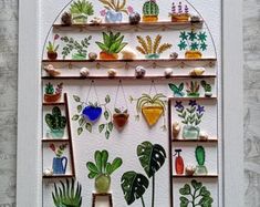 this is an image of a wall hanging with plants and potted plants on it