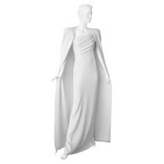 Super stunning iconic Tom Ford evening gown with matching cape. Identical to the one worn by Gwyneth Paltrow to the Oscars. The gown fashioned of off white silk crepe and lined in pure white silk charmeuse. Features lightly padded shoulders; asymmetric lightly ruched bodice and bias cut skirt which softly drapes the body. Finished with back zipper closure and high kickpleat. The cape of identical fabric is secured by concealed hooks and loops on inside neckline of dress. The cape is double backe Mugler Gown, Pretty Formal Dresses, Gown Cape, Tom Ford For Gucci, 2004 Runway, Nude Skirt, Oscar Gowns, Cape Fashion, Suits Outfits