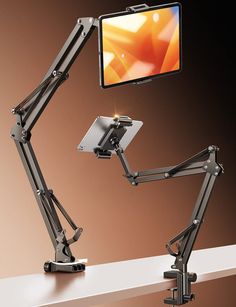 an image of a desk lamp with a monitor on it's back and arm