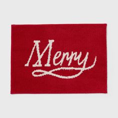 a red merry towel with the word merry written in white on it's side